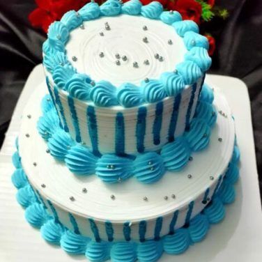 wedding cake, festive multi-storey cake, a cake in white and blue tones,  blue flowers on the cake, European wedding American wedding - Stock Image -  Everypixel